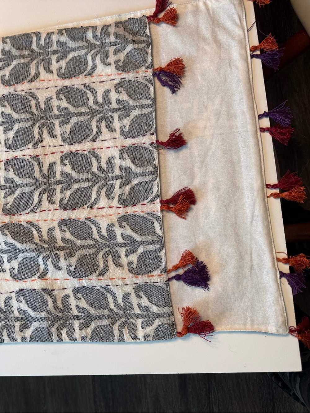 Gray Patterned table runner with tassels